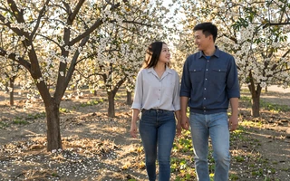 Asian-American farm couple in a California orchard - Asian farmers dating community